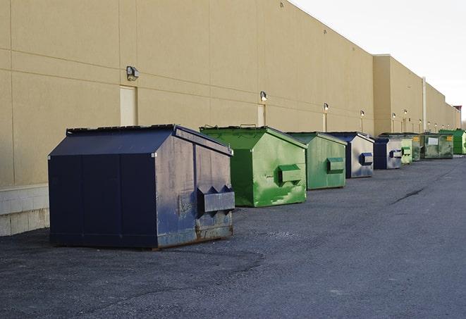 a row of large construction dumpsters on-site in Calverton, MD